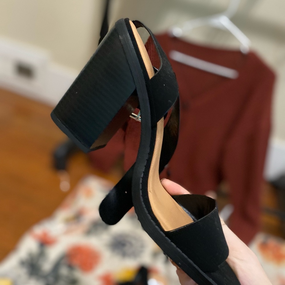 Black high heels with an ankle buckle